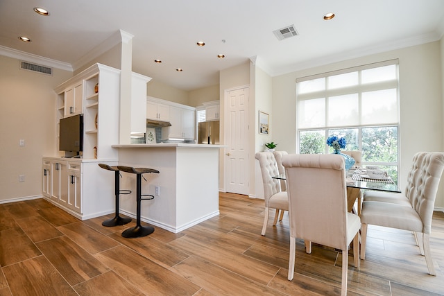 dining room with ornamental molding