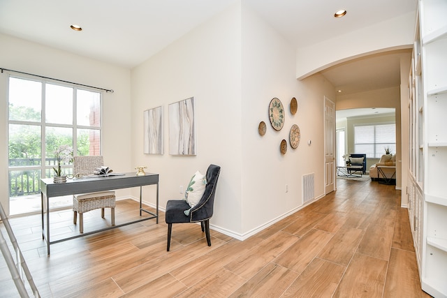 office area with light hardwood / wood-style floors