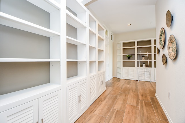 hall with light hardwood / wood-style floors