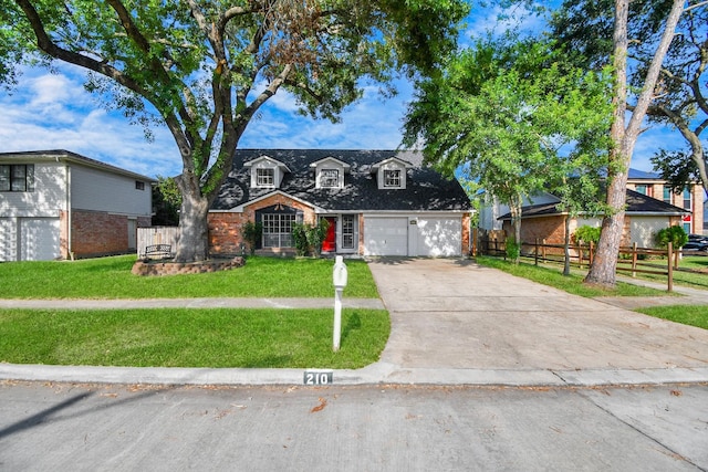 view of front of property featuring a garage and a front lawn