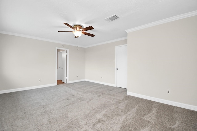 carpeted empty room with ceiling fan and ornamental molding