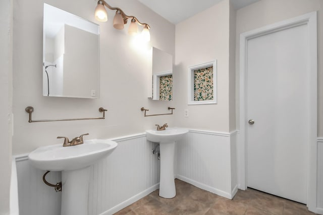 bathroom featuring double sink