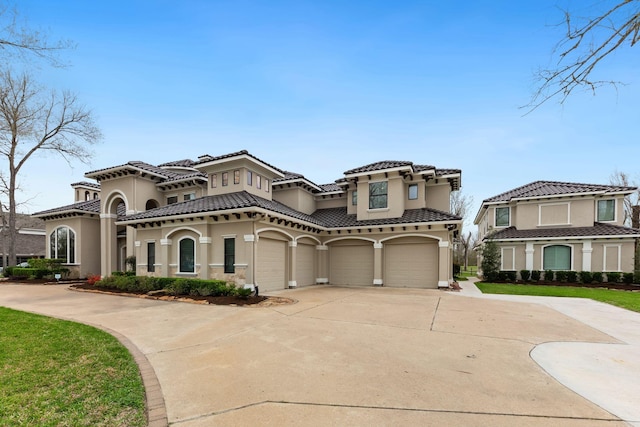 mediterranean / spanish-style home with a garage