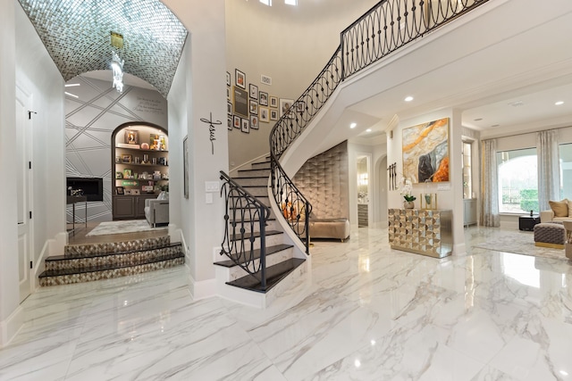 foyer entrance featuring a towering ceiling