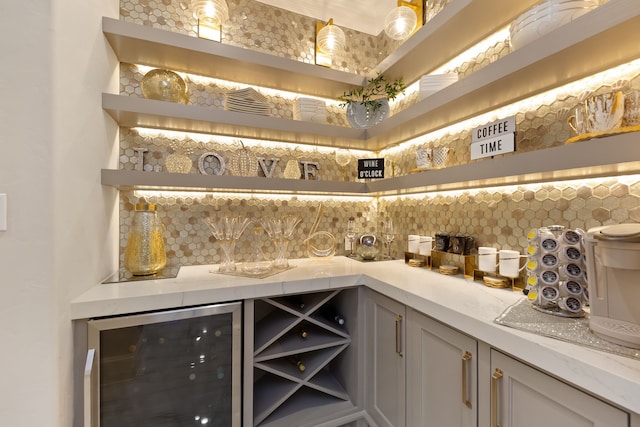 bar featuring backsplash and beverage cooler