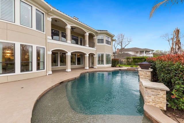 view of swimming pool featuring a patio