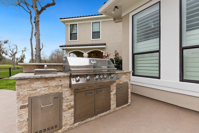 view of patio / terrace with a grill and exterior kitchen