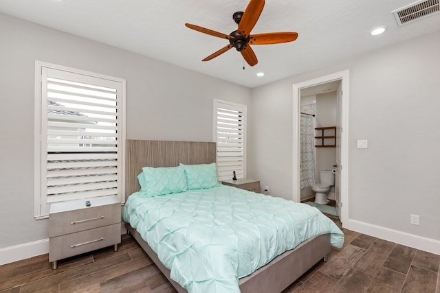 bedroom with ceiling fan, dark hardwood / wood-style flooring, and connected bathroom