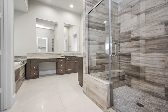 bathroom with tile patterned flooring, vanity, and independent shower and bath