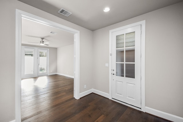 entrance foyer featuring ceiling fan and dark wood-type flooring