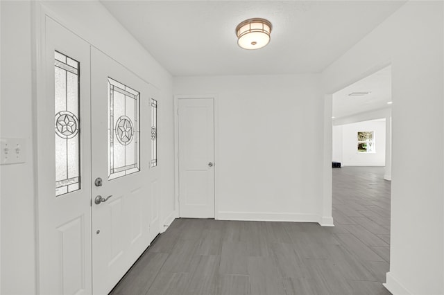 foyer with light hardwood / wood-style floors and a wealth of natural light