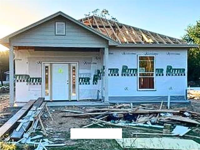 unfinished property featuring a porch