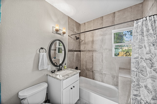 full bathroom featuring vanity, shower / bath combination with curtain, and toilet