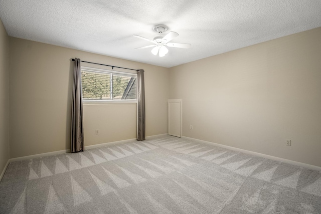 12114 Knobcrest Dr, Houston, TX 77070 - spare room with a textured ceiling, a ceiling fan, light colored carpet, and baseboards