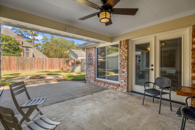 12114 Knobcrest Dr, Houston, TX 77070 - view of patio with a fire pit, fence, and ceiling fan