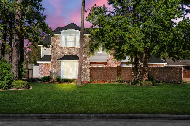 view of front of home featuring a yard