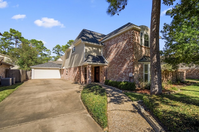 12114 Knobcrest Dr, Houston, TX 77070 - view of front of property featuring brick siding, central AC unit, and fence