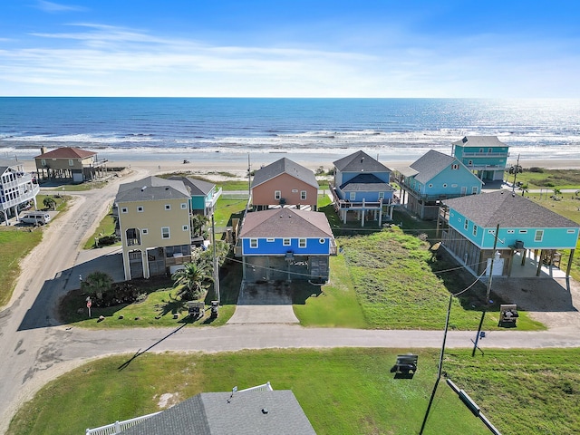 aerial view with a water view and a view of the beach