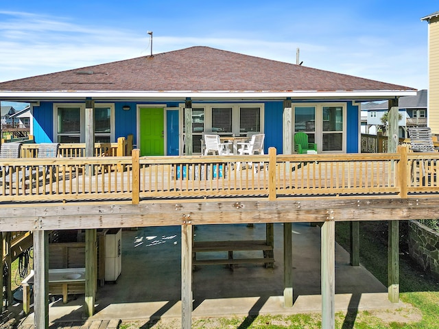 rear view of house with a wooden deck