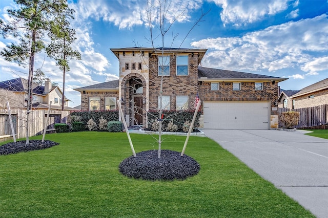 view of front of house featuring a front yard and a garage