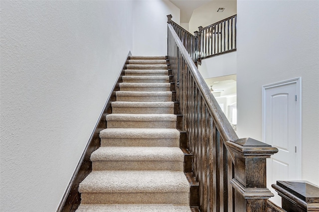 stairs with wood-type flooring