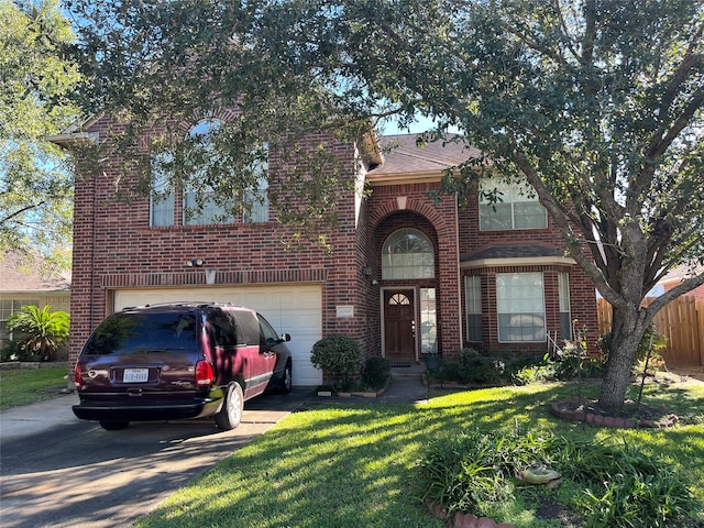 view of front of home featuring a garage and a front lawn