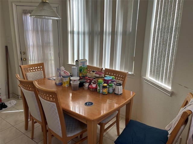 dining space with light tile patterned floors