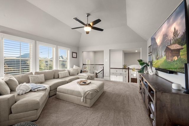 carpeted living room featuring ceiling fan and lofted ceiling