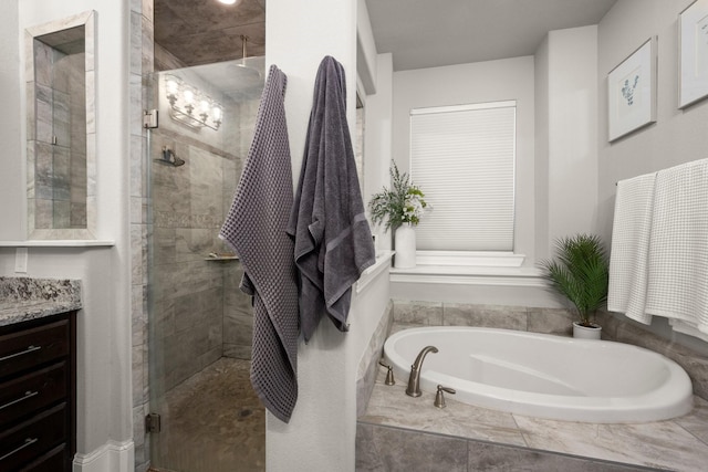 bathroom featuring vanity and plus walk in shower