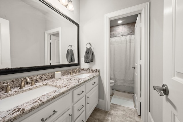 bathroom featuring vanity, toilet, and a shower with shower curtain