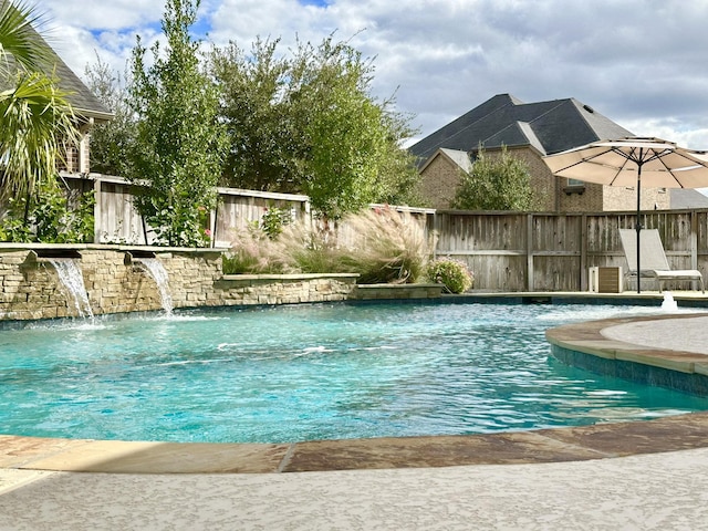 view of swimming pool featuring pool water feature