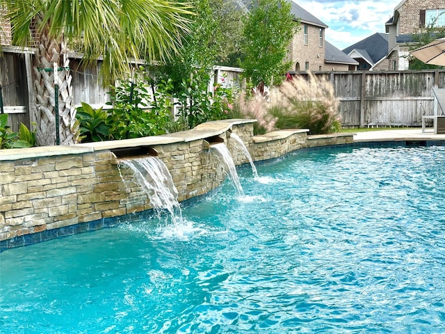 view of pool featuring pool water feature