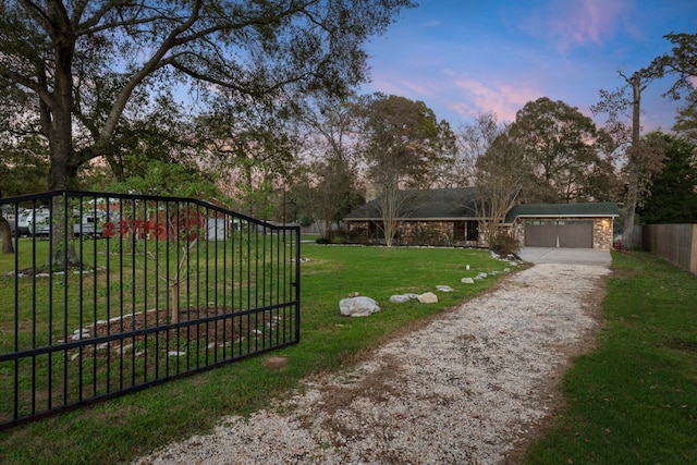 gate at dusk with a lawn