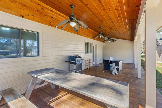 wooden terrace with a grill