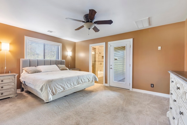 carpeted bedroom with ceiling fan and ensuite bathroom