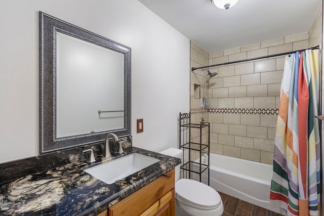 full bathroom featuring vanity, hardwood / wood-style flooring, toilet, and shower / bath combo with shower curtain