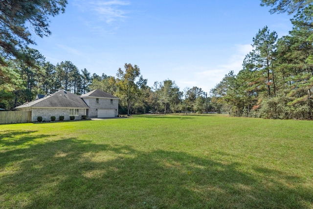 view of yard with a garage