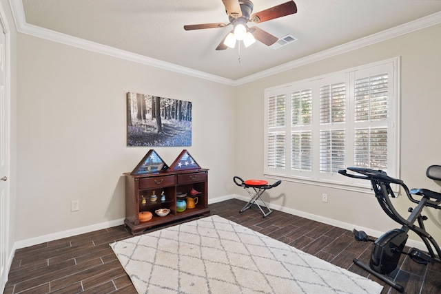 exercise area featuring ceiling fan and crown molding