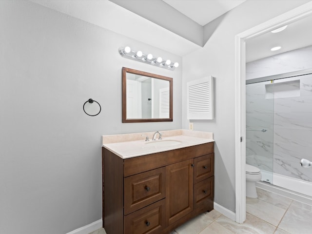 bathroom featuring toilet, vanity, tile patterned floors, and a shower with shower door