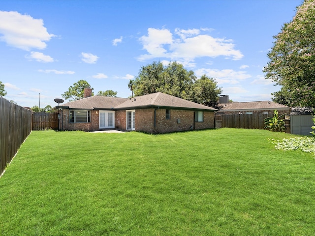 view of yard featuring french doors