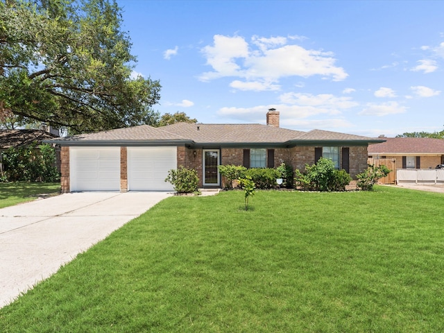 ranch-style home with a garage and a front lawn