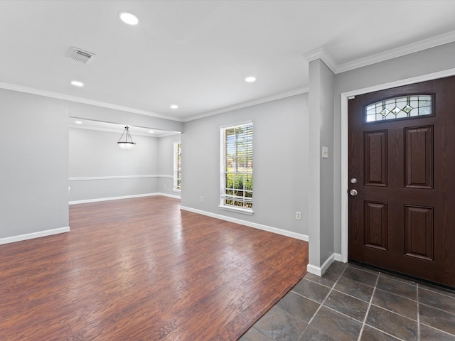 entrance foyer featuring ornamental molding and dark wood-type flooring