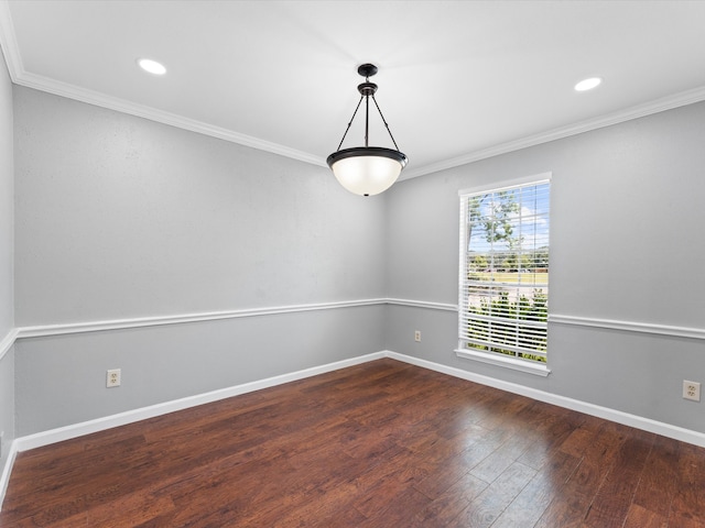 empty room with dark hardwood / wood-style floors and ornamental molding