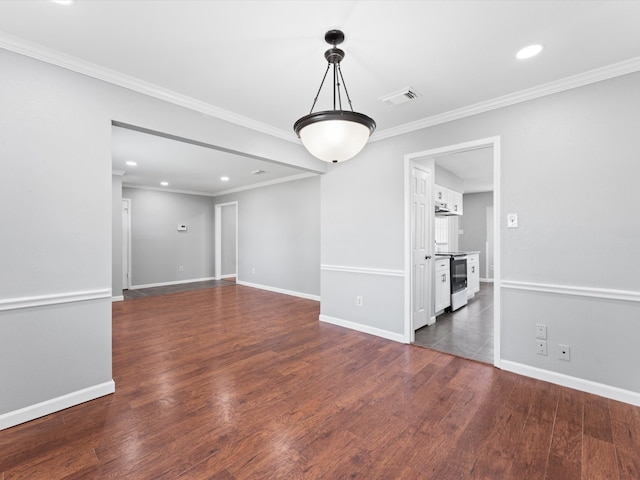 unfurnished room featuring crown molding and dark wood-type flooring