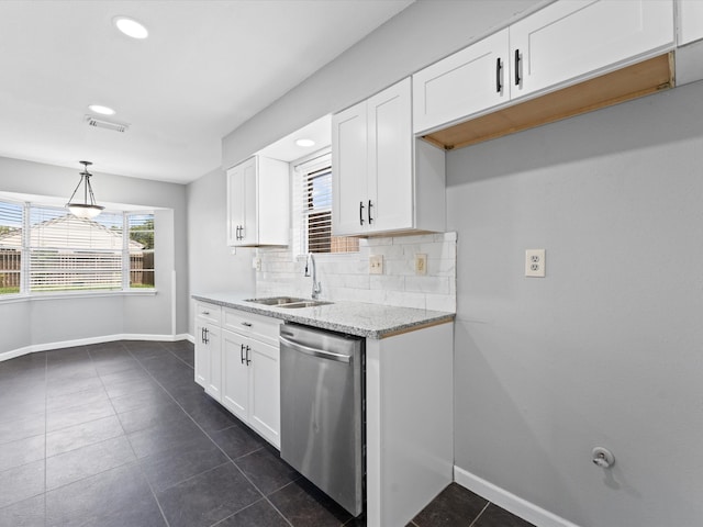 kitchen with white cabinets, dishwasher, pendant lighting, and tasteful backsplash