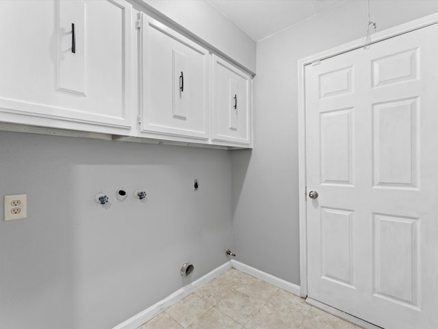 laundry room with gas dryer hookup, cabinets, washer hookup, light tile patterned floors, and hookup for an electric dryer