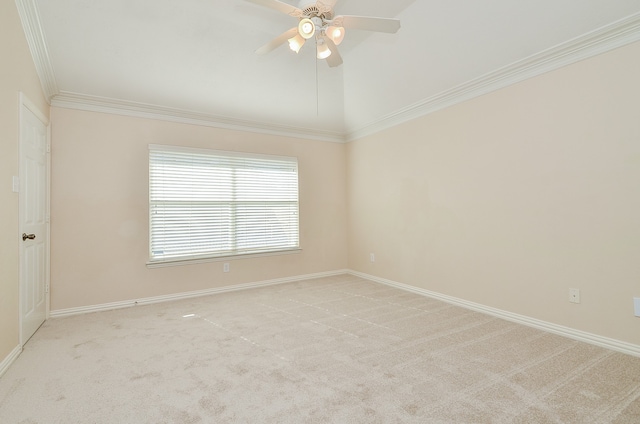 carpeted empty room with ceiling fan and crown molding