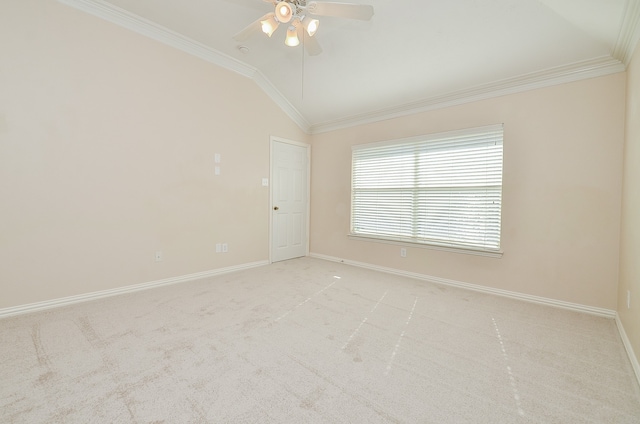 carpeted spare room with ornamental molding, ceiling fan, and lofted ceiling