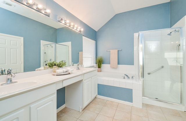 bathroom featuring tile patterned floors, vanity, shower with separate bathtub, and vaulted ceiling