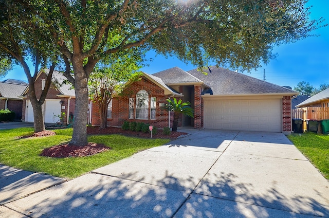 ranch-style house featuring a garage and a front yard